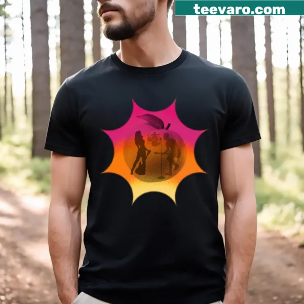 T-shirt featuring a band silhouette against a peach sun background.
