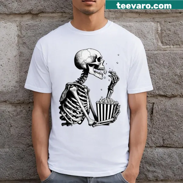 T-shirt featuring a skeleton eating popcorn