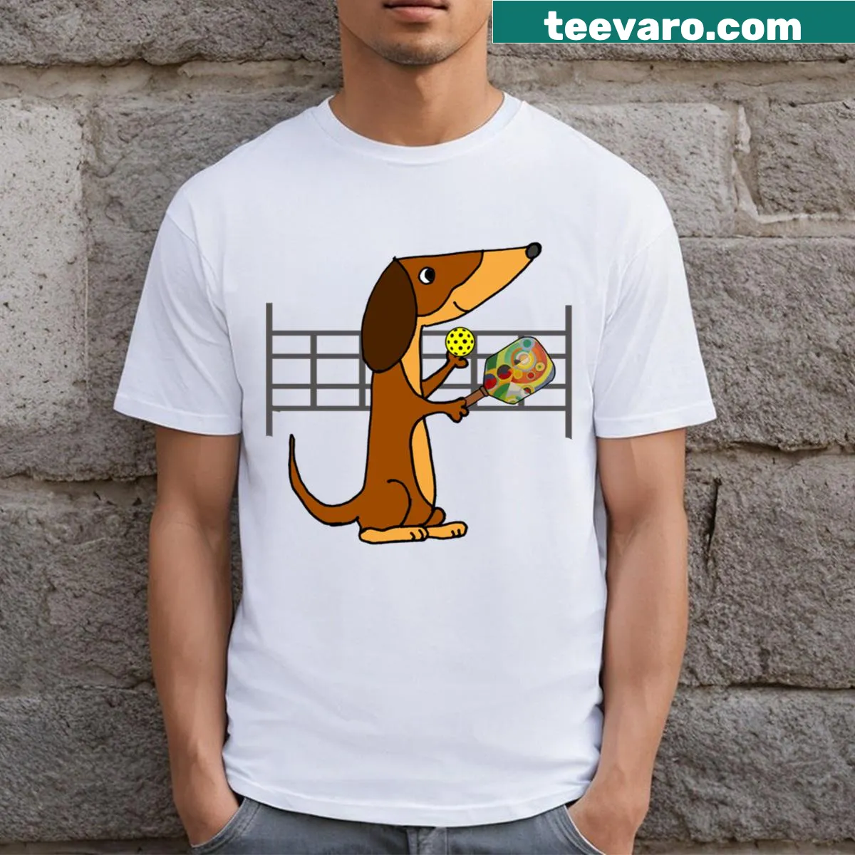Funny T-shirt with dachshund playing pickleball — on a men's t-shirt
