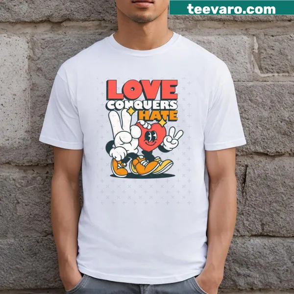 Inspirational T-shirt with the phrase 'Love Conquers Hate' in bold design.