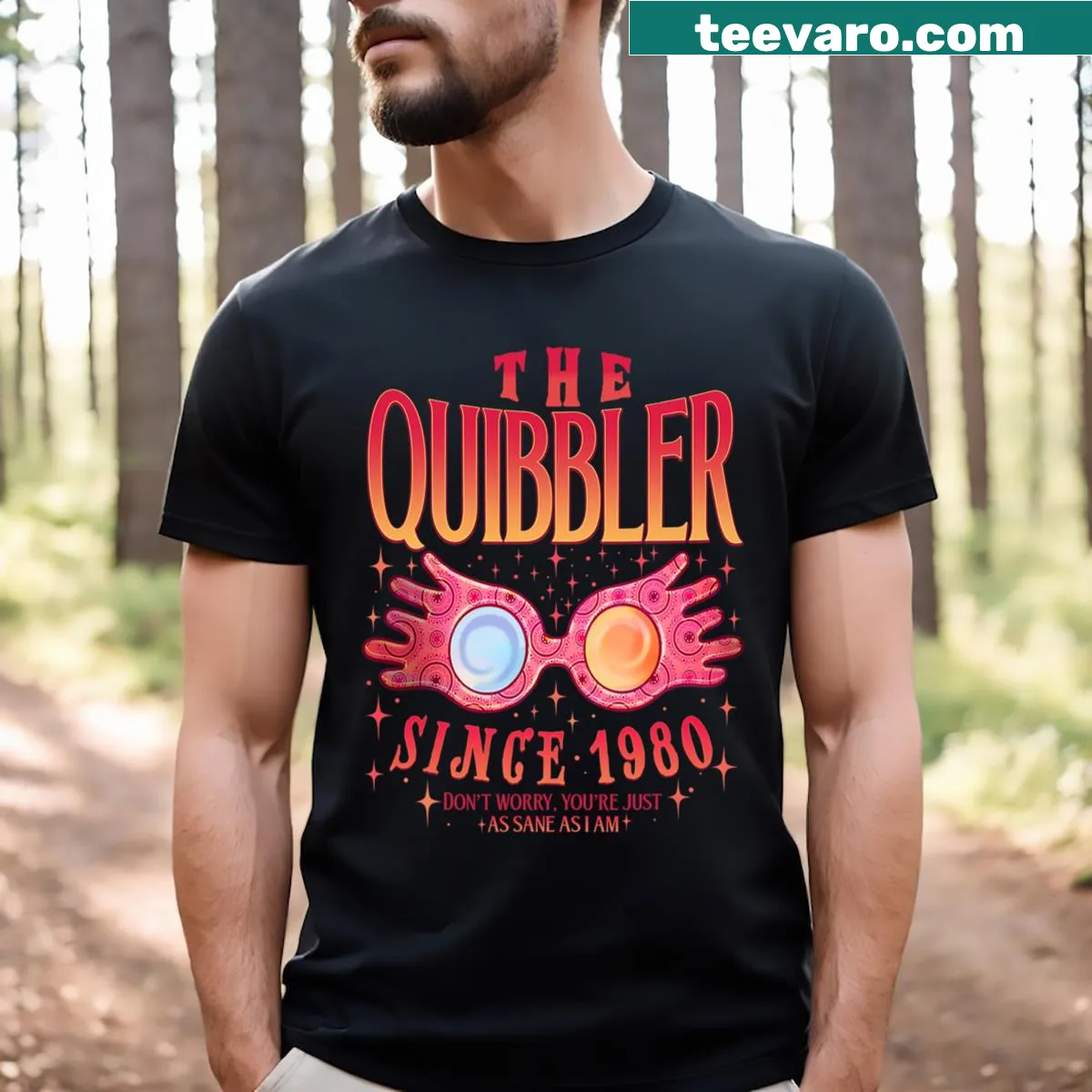 Book-themed T-shirt with The Quibbler Since 1980 text — on a men's t-shirt