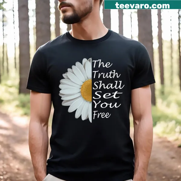 T-shirt with a daisy graphic and inspirational saying in white lettering.
