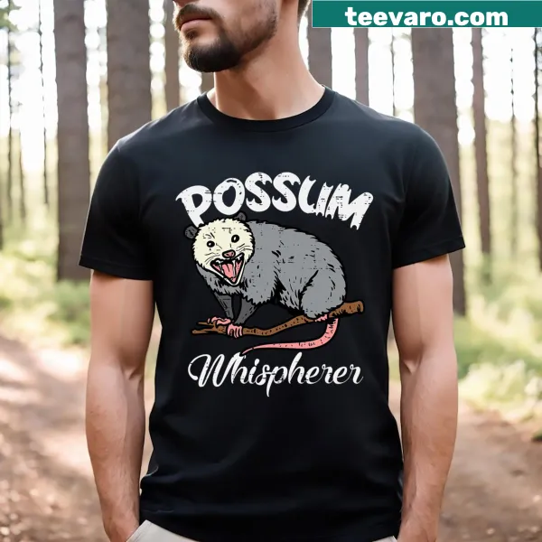 Funny T-shirt featuring the phrase 'Possum Whisperer' with an illustration