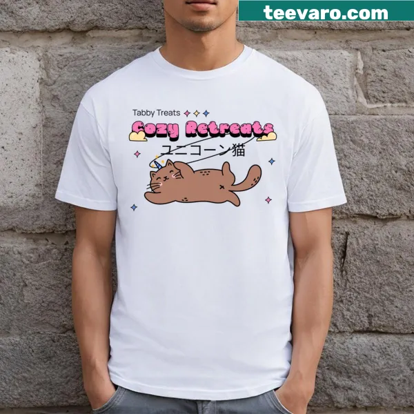 Charming T-shirt featuring cartoon tabby cats in cozy settings.