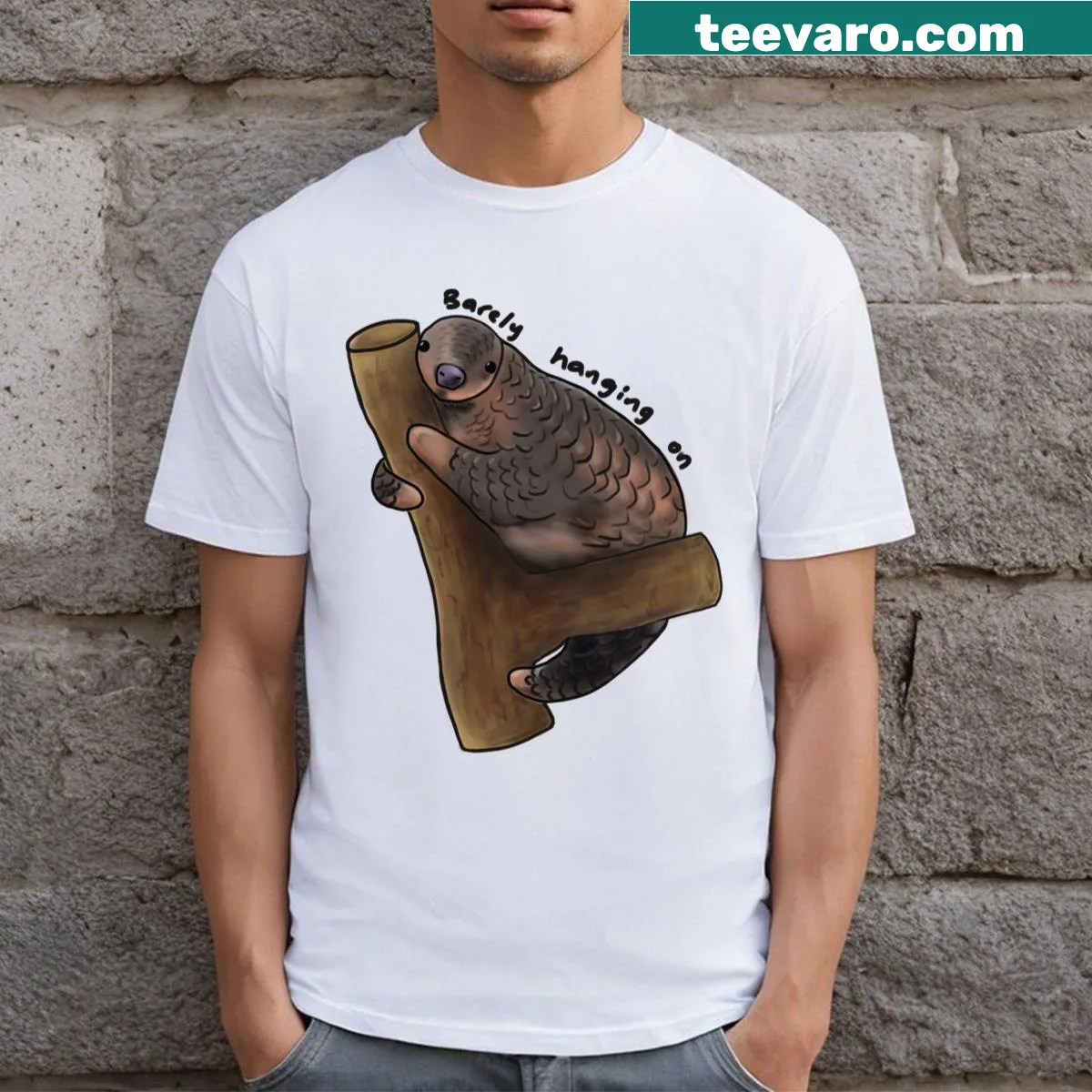 Cartoon T-shirt featuring a humorous pangolin clinging on for dear life — on a men's t-shirt