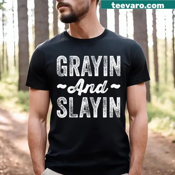 Funny gym T-shirt with the phrase 'Grayin And Slayin' in bold text