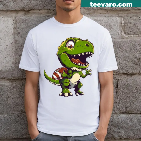 Cute baby dinosaur playing football illustrated on a kids t-shirt