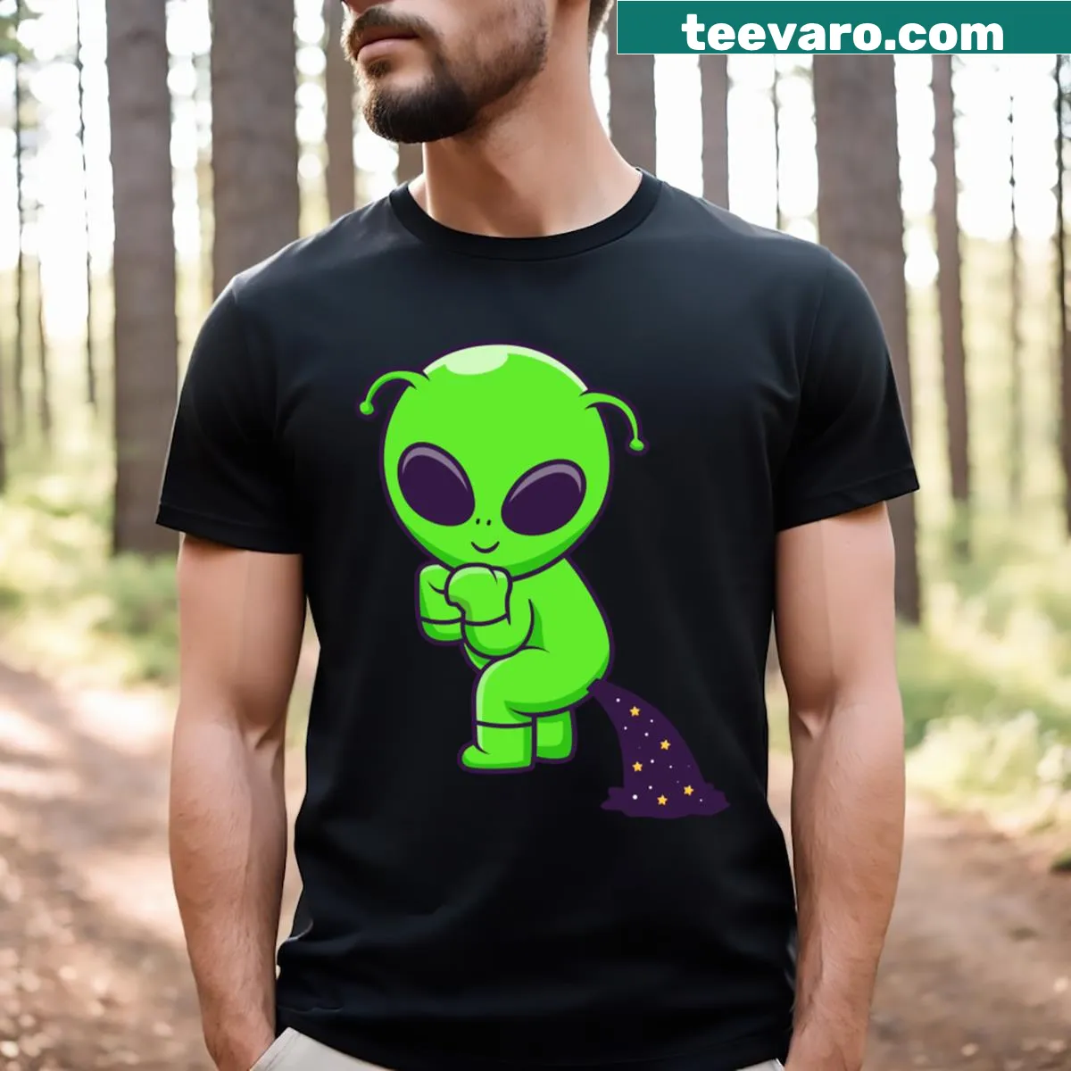 Humorous Cute Alien Pooping Space T-shirt with cartoon design. — on a men's t-shirt