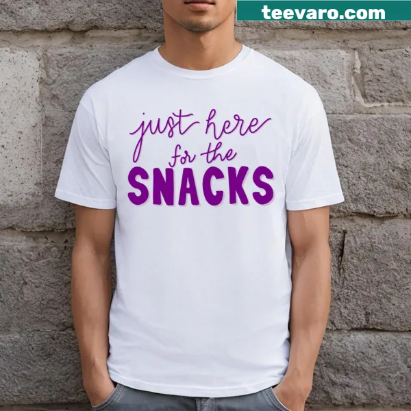 T-shirt featuring the phrase 'Just Here For The Snacks' in bold lettering