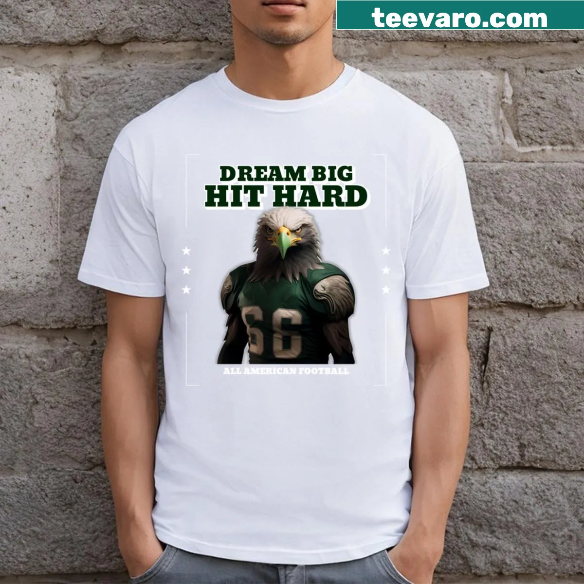 Motivational football T-shirt with 'Dream Big Hit Hard' text — on a men's t-shirt
