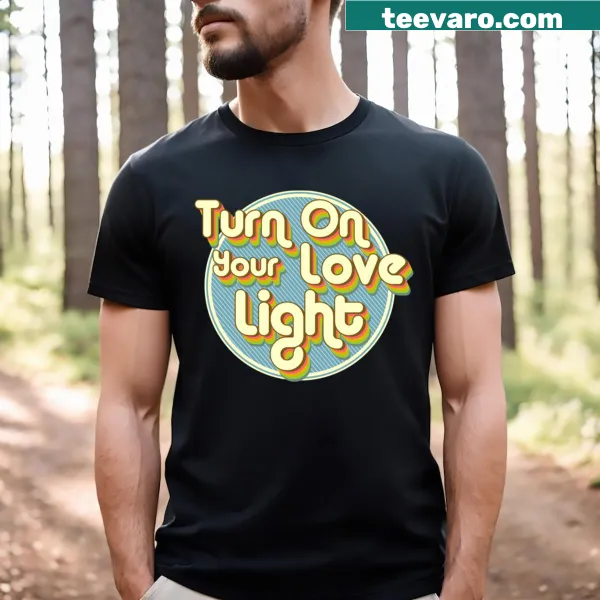 Typographic design encouraging positivity on Turn On Your Love Light T-shirt