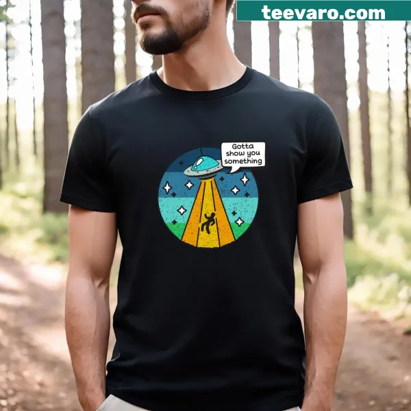 Cartoon alien abduction graphic t-shirt with humorous design
