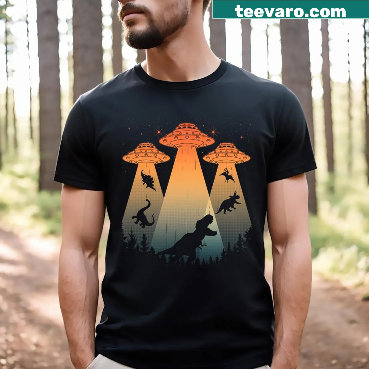 Illustrative T-shirt featuring a dinosaur being abducted by a UFO — on a men's t-shirt