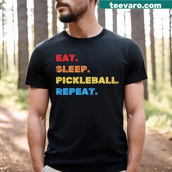 T-shirt featuring bold text: 'Eat Sleep Pickleball Repeat'