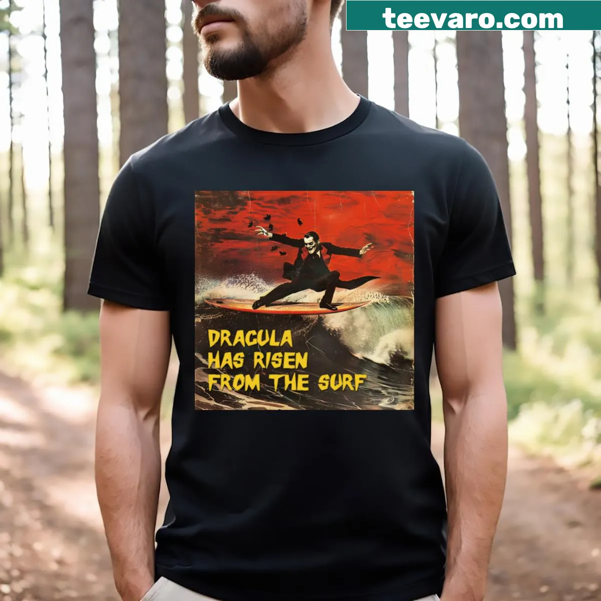 Graphic of Dracula rising from the surf with playful elements — on a men's t-shirt