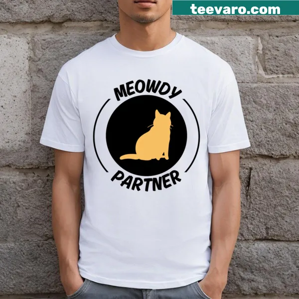 Playful T-shirt with a cat and cowboy theme, saying 'Meowdy Partner.'