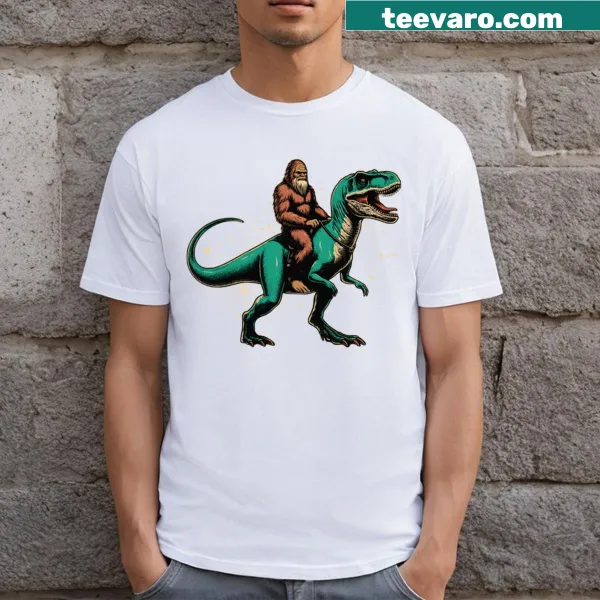 Whimsical T-shirt featuring Sasquatch and dinosaur illustration