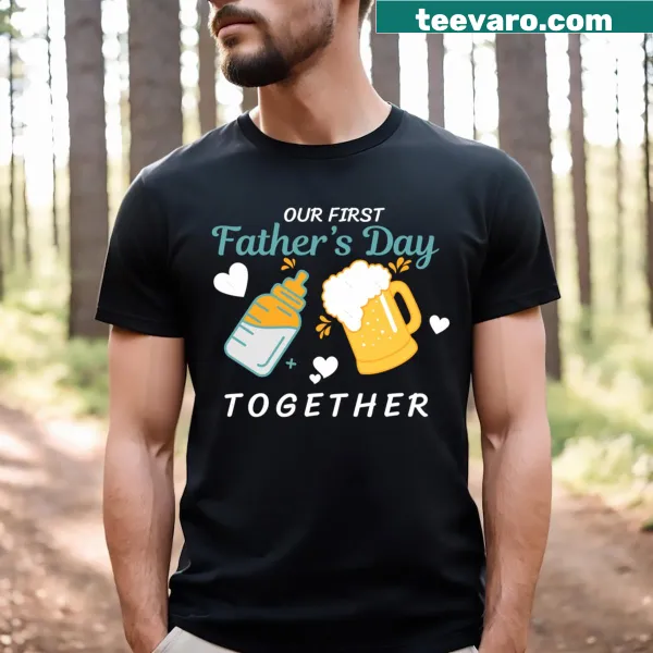 Black T-shirt celebrating a dad's first Father's Day with baby son