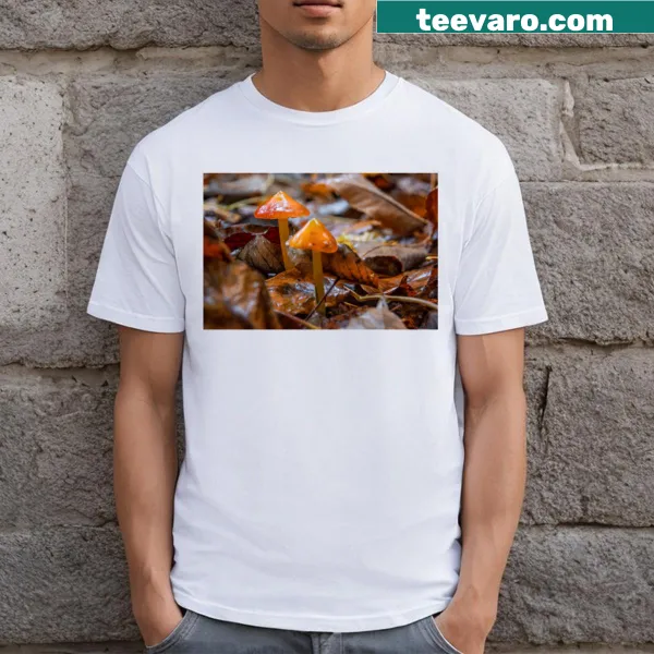 Nature-themed T-shirt featuring mushrooms on a forest floor