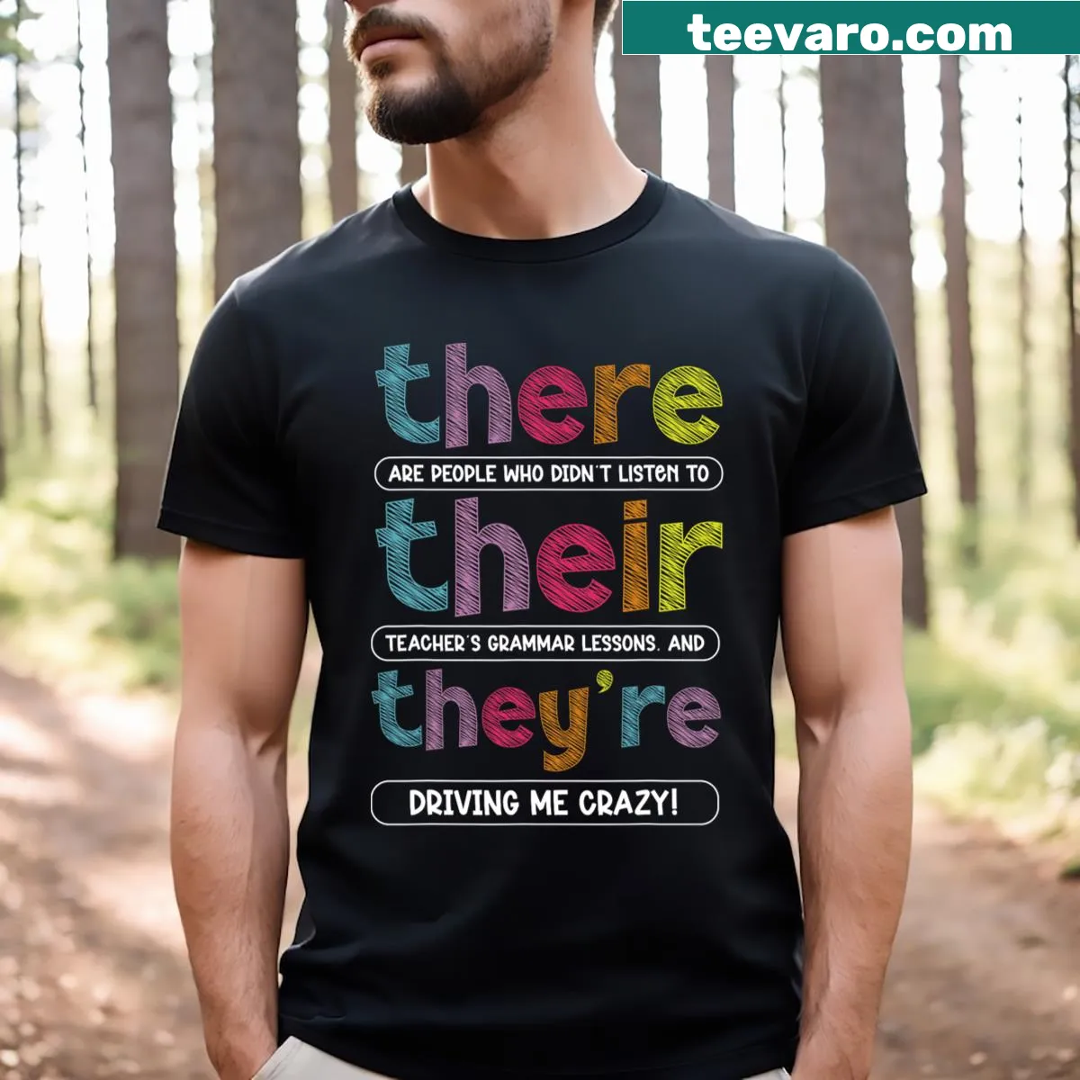 Humorous English grammar teacher t-shirt with 'There Their They're' printed — on a men's t-shirt