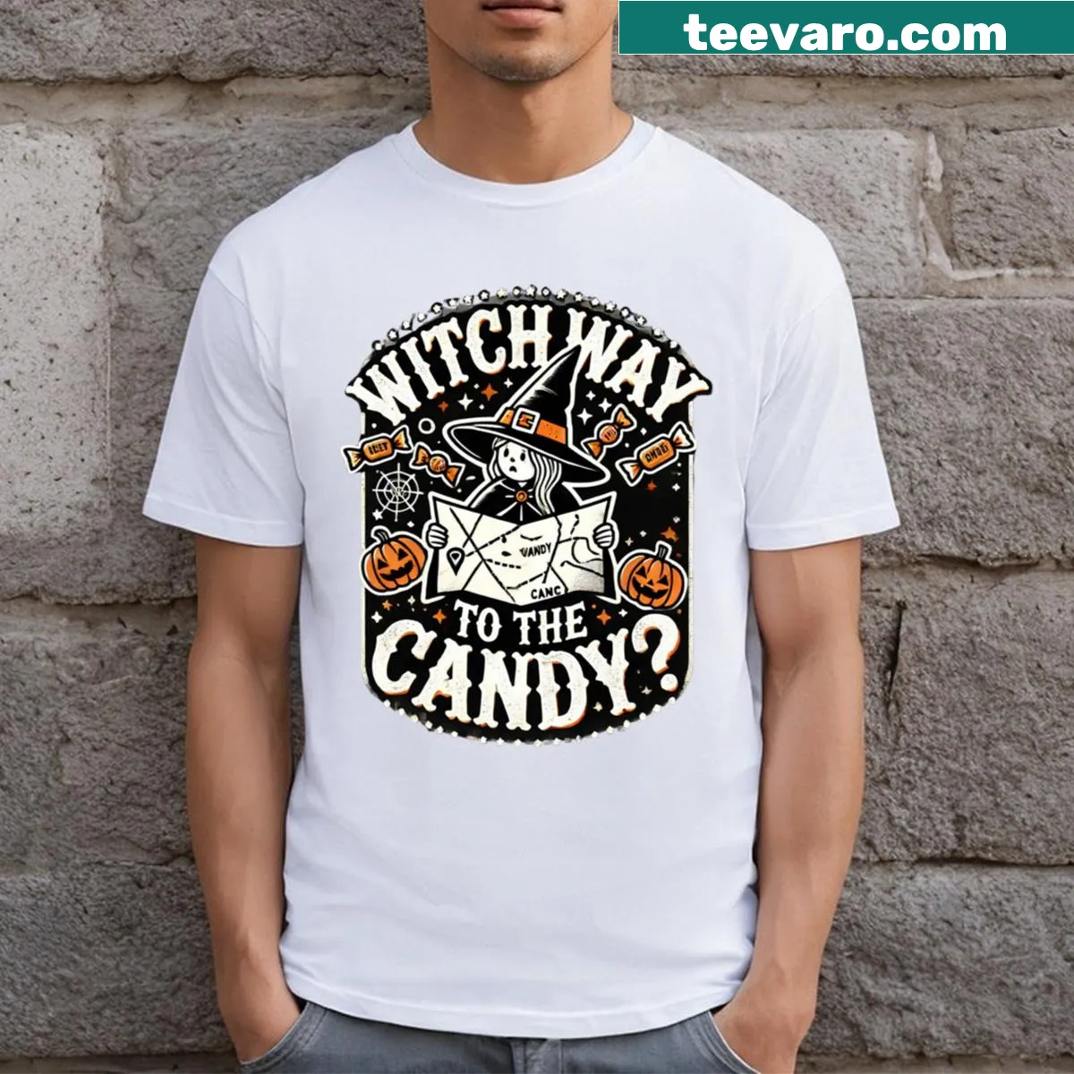 Halloween T-shirt with a whimsical illustration asking 'Witch Way To The Candy?' — on a men's t-shirt