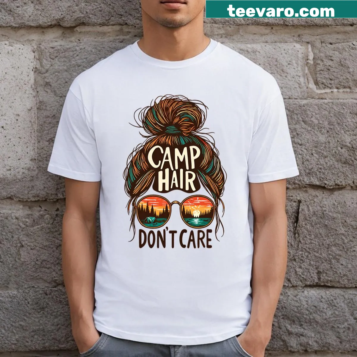 Funny camping t-shirt with the phrase 'Camp Hair Don't Care' and a messy bun graphic. — on a men's t-shirt