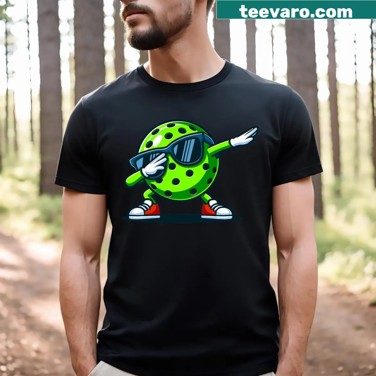 Funny t-shirt featuring a cartoon dabbing pickleball player — on a men's t-shirt