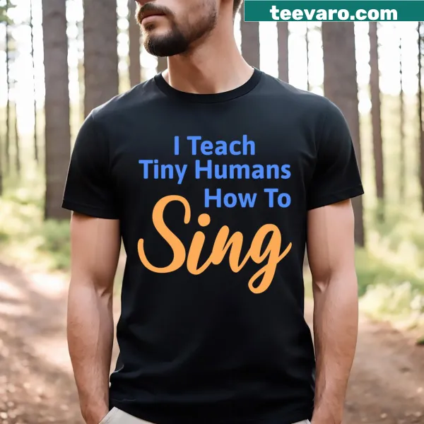T-shirt for music teachers featuring the phrase 'I Teach Tiny Humans How To Sing!' in fun design.