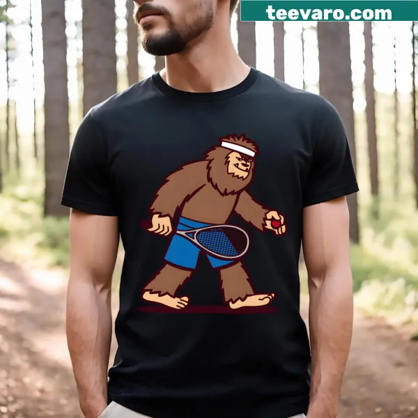 Funny squash-playing Sasquatch cartoon t-shirt.