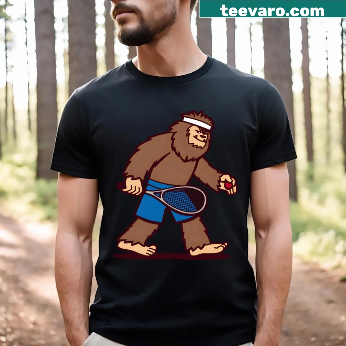 Funny squash-playing Sasquatch cartoon t-shirt. — on a men's t-shirt