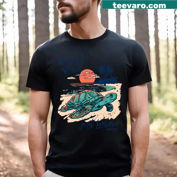 Inspirational t-shirt with 'Don't Be Afraid Just Believe' text and turtle graphic