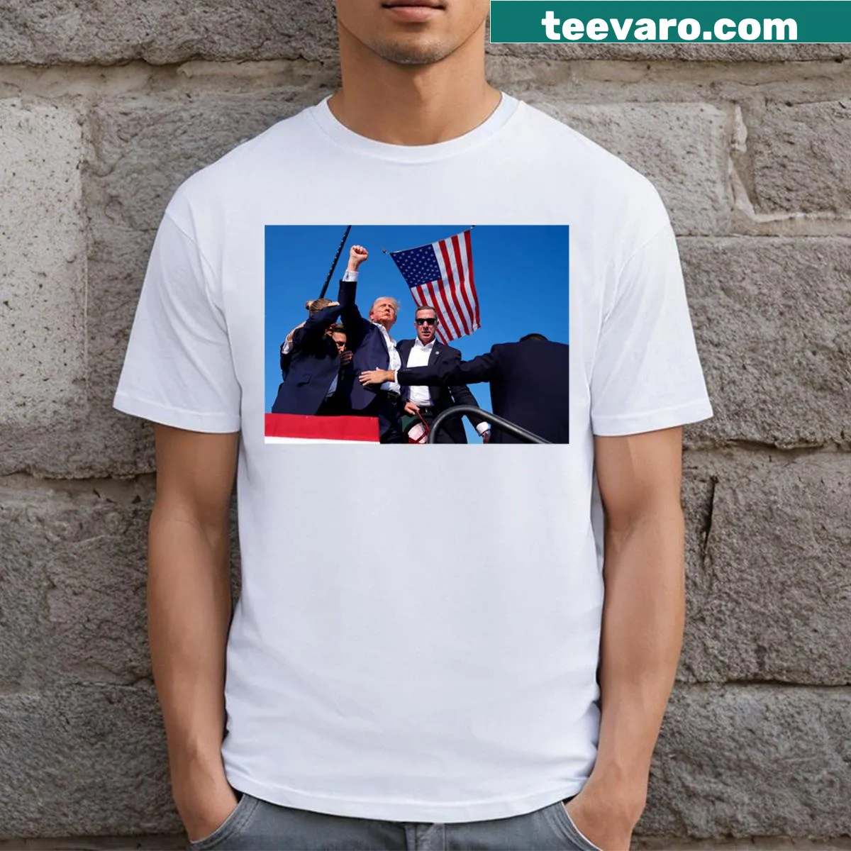 T-shirt featuring a fist pump illustration supporting Trump 2024 — on a men's t-shirt