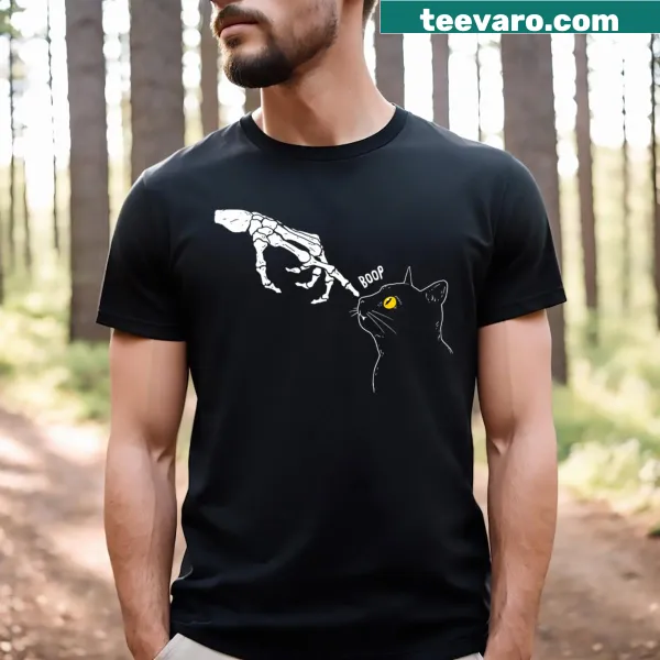 Cute Halloween-themed T-shirt featuring a spooky cat graphic