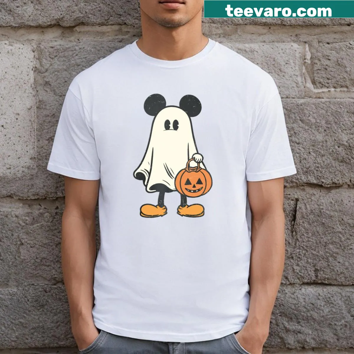 Vintage-style Halloween t-shirt with a ghost and pumpkin graphic — on a men's t-shirt