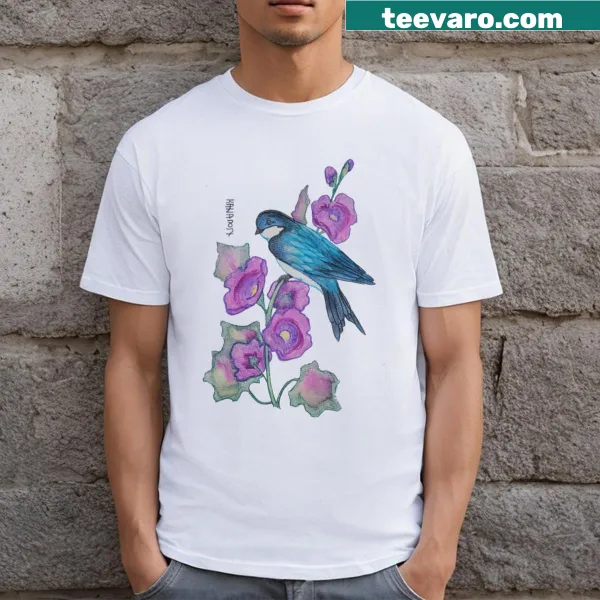T-shirt featuring an illustration of a swallow and hollyhock flowers.