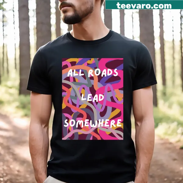 T-shirt with inspirational text 'All Roads Lead Somewhere' in sleek typography