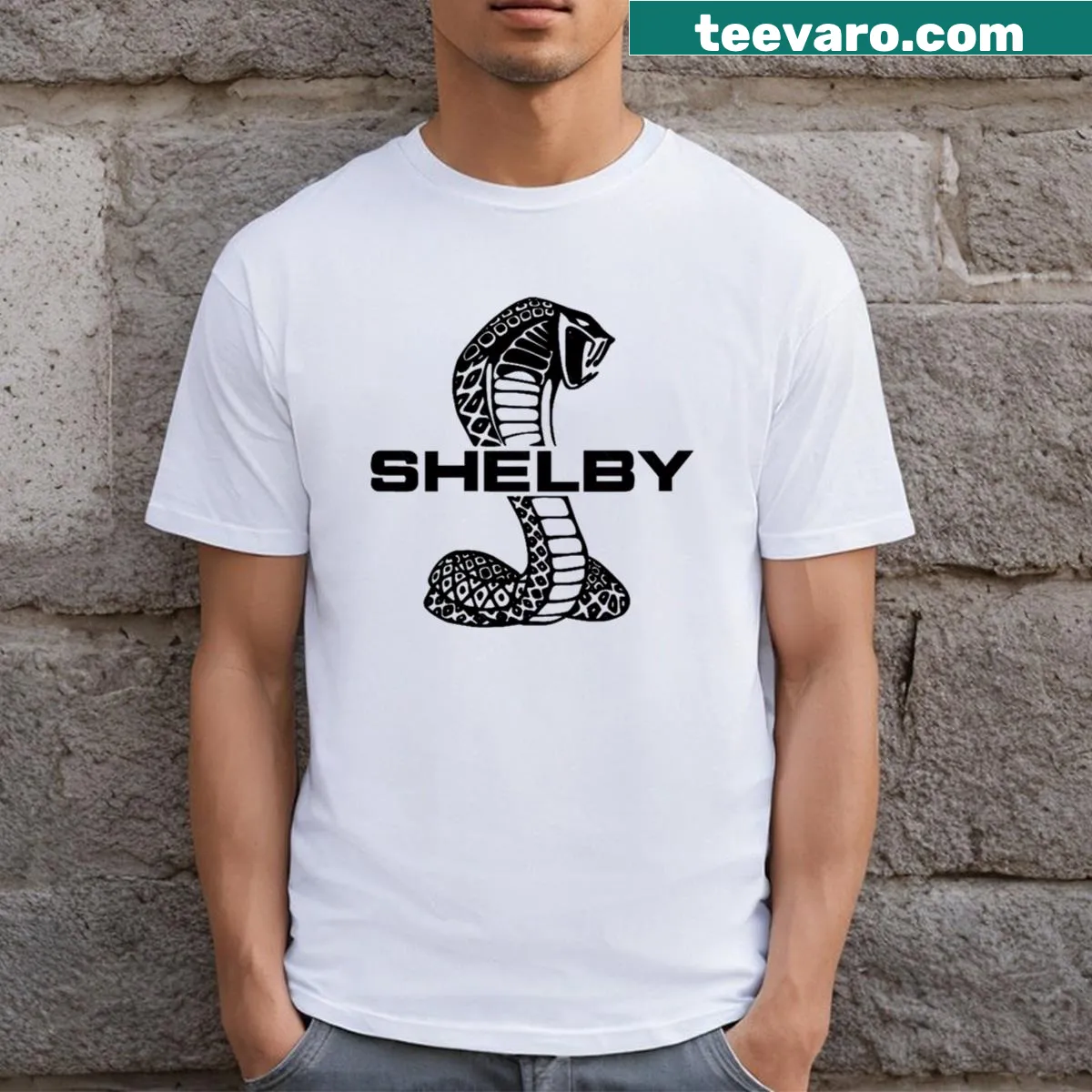 Black T-shirt featuring bold Shelby logo design — on a men's t-shirt