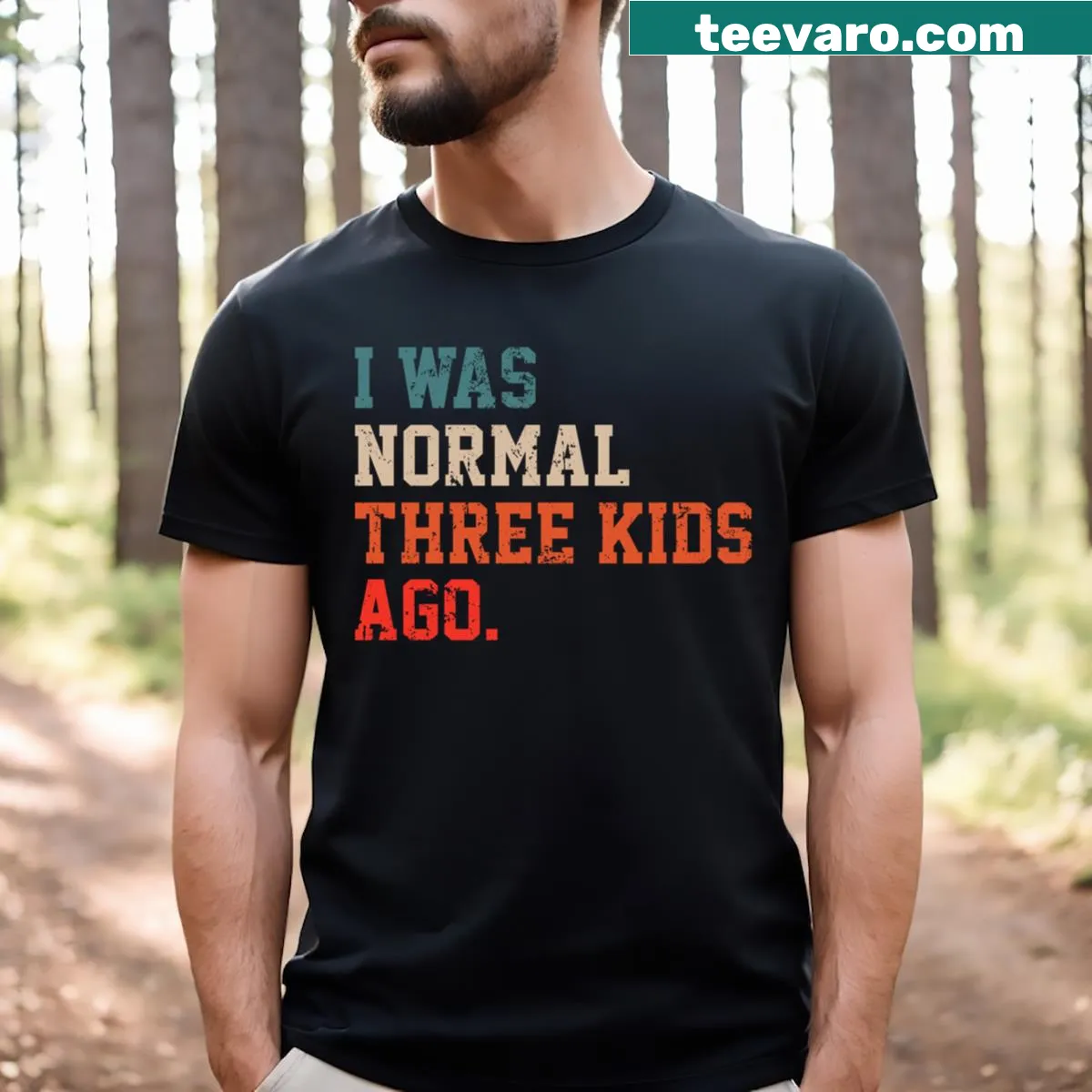 Humorous t-shirt declaring parenthood chaos with playful typography — on a men's t-shirt