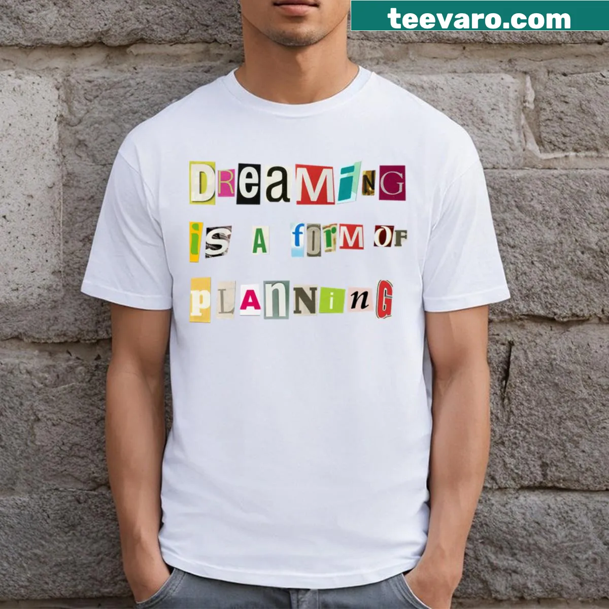 Inspirational T-shirt with the phrase 'Dreaming Is A Form Of Planning' — on a men's t-shirt