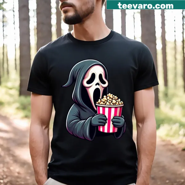 T-shirt featuring playful horror graphic inviting to watch scary movies.
