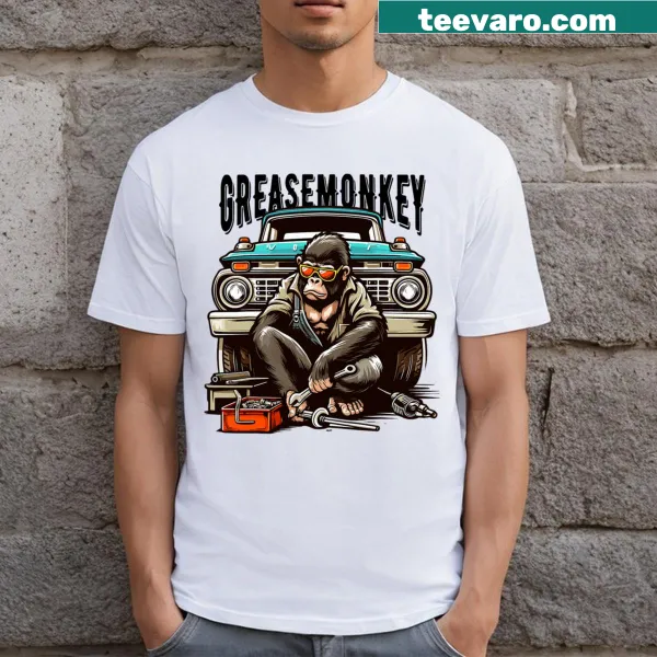Graphic of a grease monkey with sunglasses working on a vintage truck