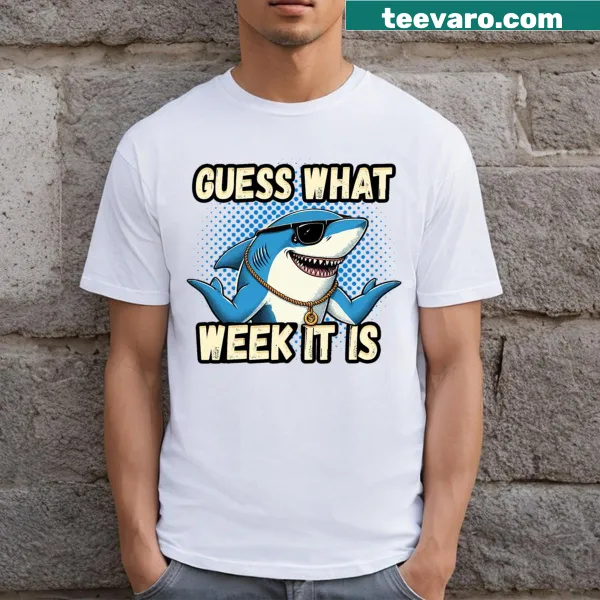 Funny shark-themed t-shirt that reads 'Guess What Week It Is'