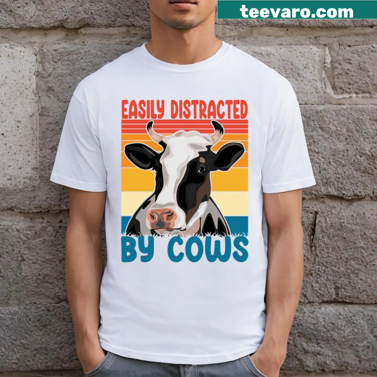Cartoon cow graphic with the phrase 'Easily Distracted By Cows' on t-shirt — on a men's t-shirt