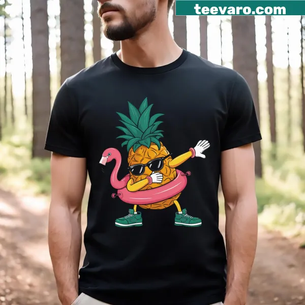 Tropical T-shirt featuring a dabbing pineapple and pink flamingo.