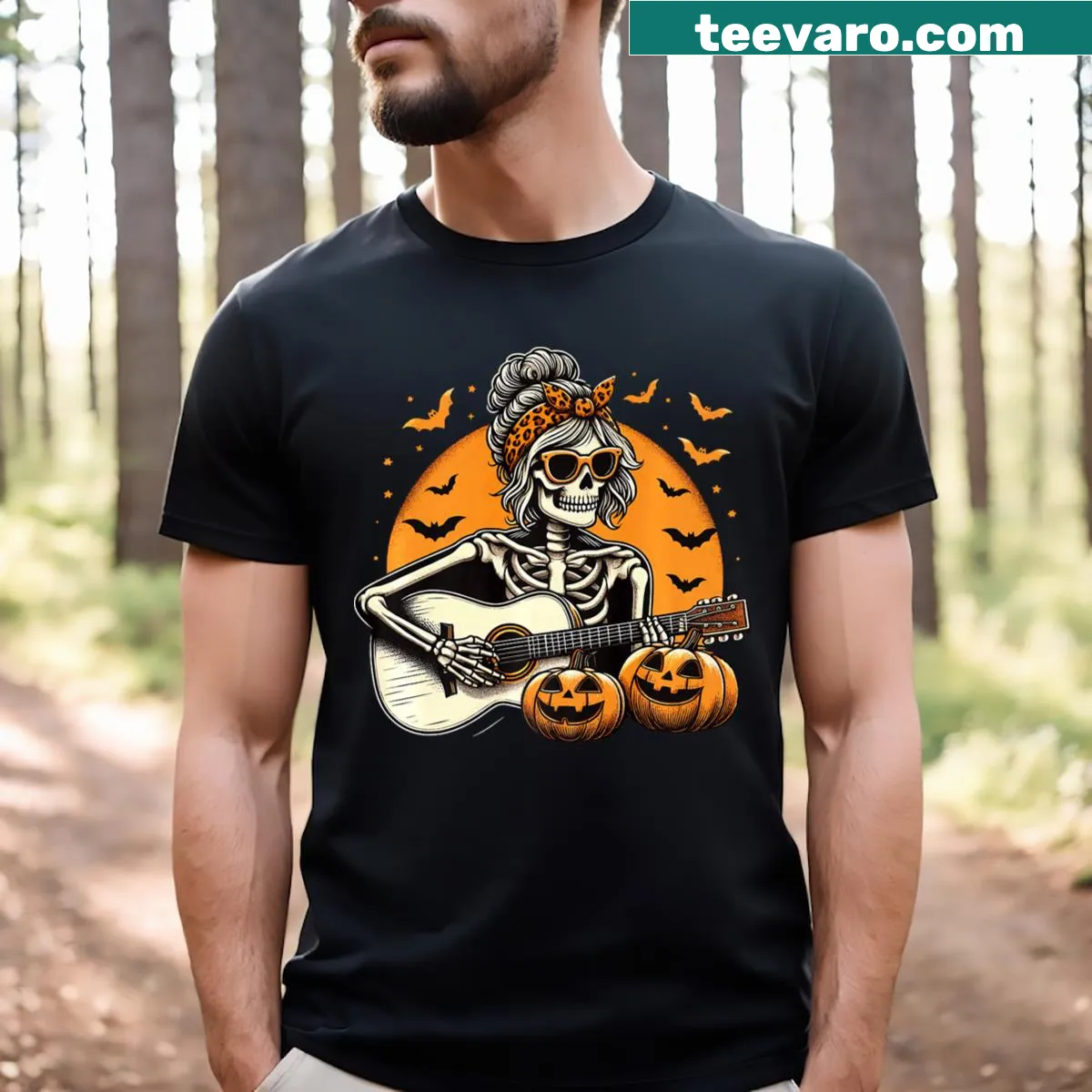 Cartoon skeleton playing guitar with pumpkin on Halloween t-shirt — on a men's t-shirt