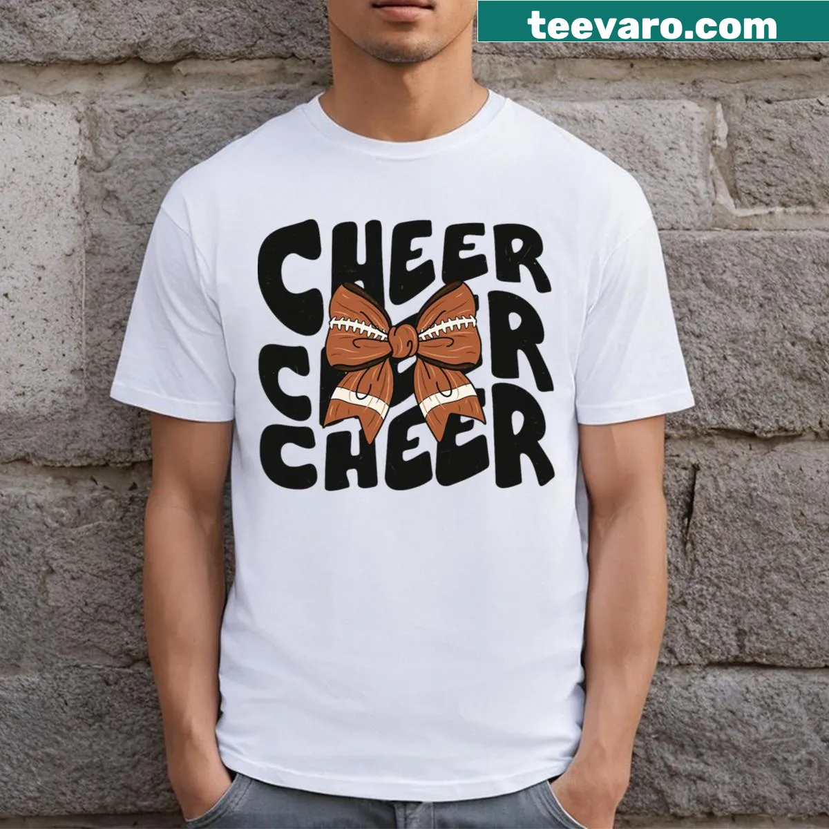 Cheer Coquette Bow t-shirt with festive football graphic — on a men's t-shirt