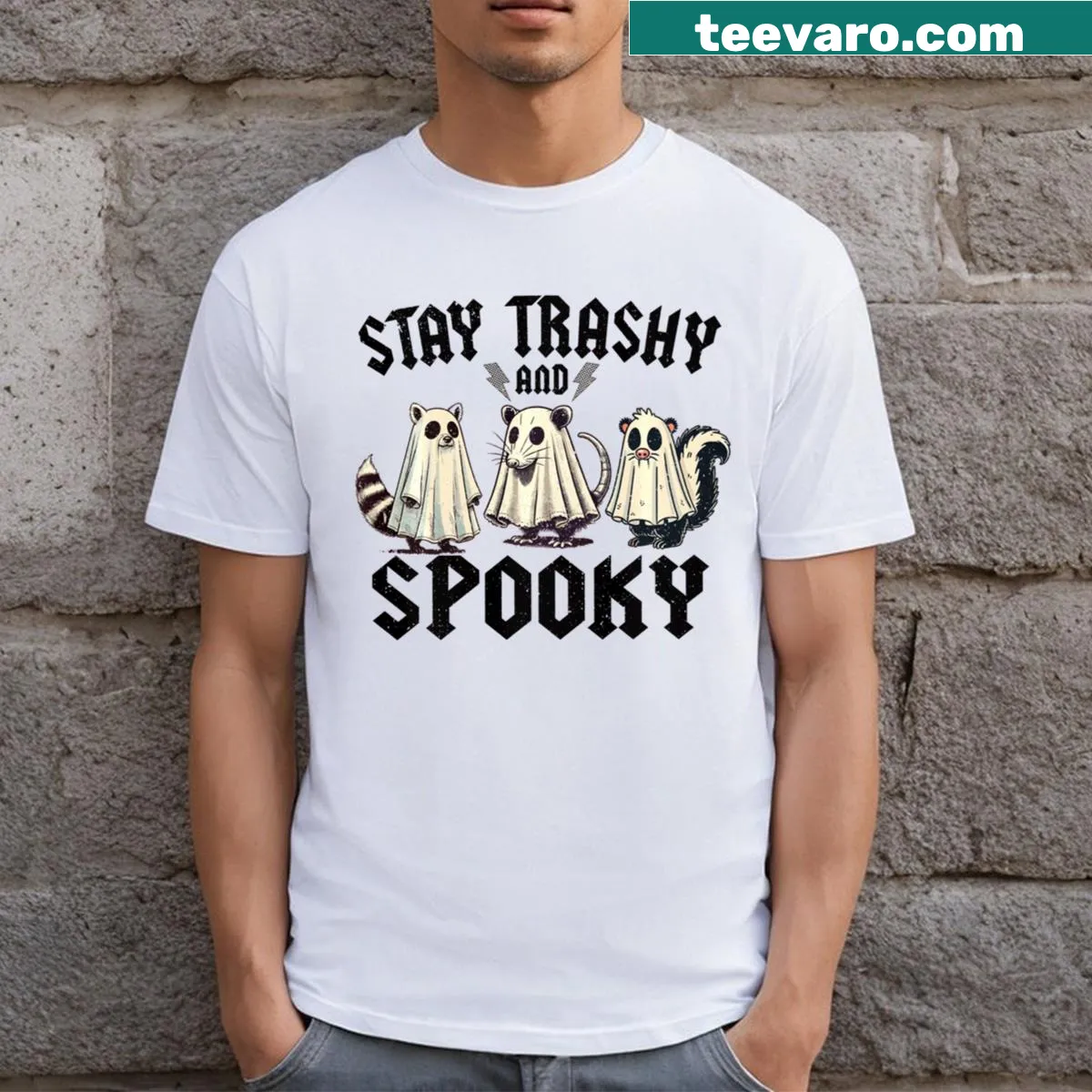 Cartoon Halloween t-shirt with raccoon and opossum designs — on a men's t-shirt