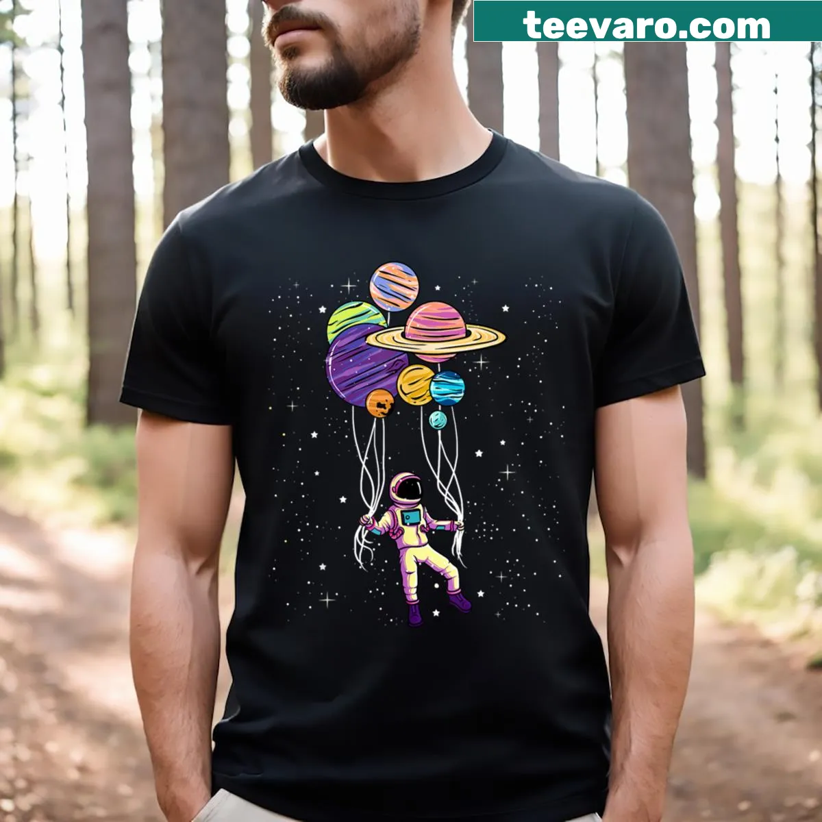 Illustration of an astronaut holding planet-shaped balloons — on a men's t-shirt