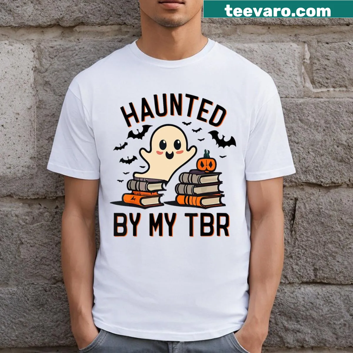 Humorous T-shirt with 'Haunted By My TBR Boo' text — on a men's t-shirt