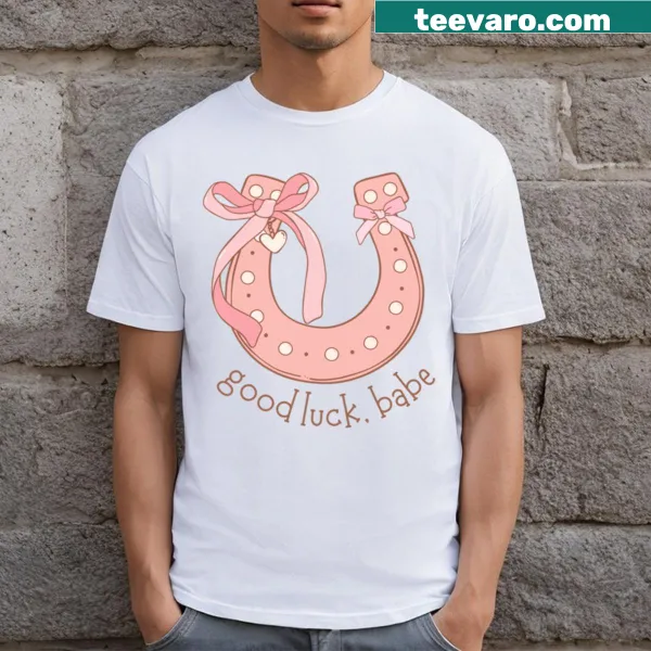 Distressed vintage-style T-shirt with a graphic of a pink horseshoe